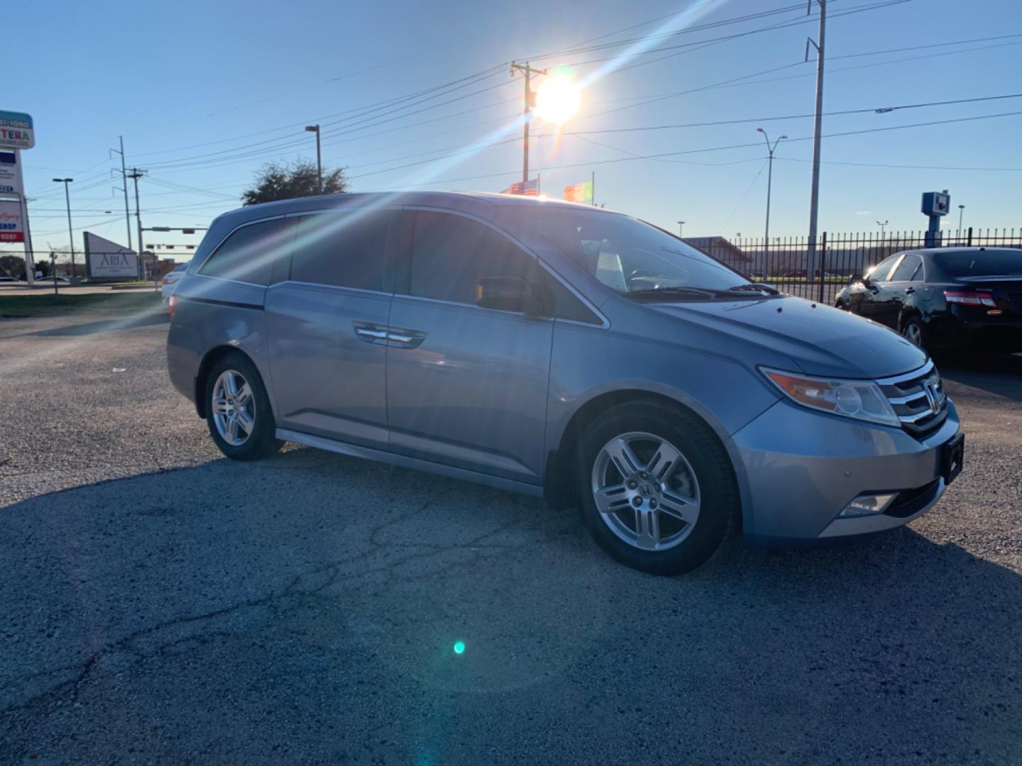 2012 Blue /gray Honda Odyssey Touring (5FNRL5H94CB) with an 3.7L L5 DOHC 20V engine, AUTOMATIC transmission, located at 1830 North Belt Line Road, Irving, TX, 75061, (469) 524-0199, 32.834373, -96.993584 - Photo#6